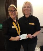 Maggie presents cheque to Heather of Air Ambulance